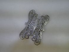 A decorative Victorian silver belt buckle of pierced pattern highlighting engraved Scroll design. Di