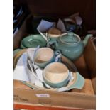 A tray of green Denby tableware