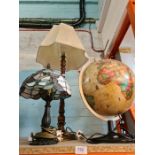 Two table lamps and an illuminated globe
