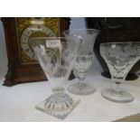 An early 19th Century, engraved glass decorated flowers on square foot and two other 19th Century en