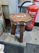 A rustic style milking stool by George Walker and an old ship awning handle