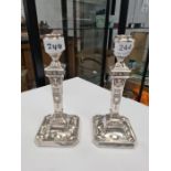 A highly decorative pair of Edwardian Adam style silver candlesticks of attractive style. Very prett