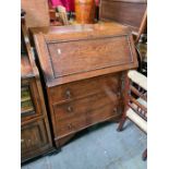 An oak Bureau having 3 long drawers, 2 chairs and sundry