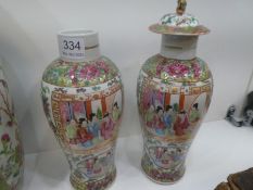 A pair of 19th Century Chinese Canton vases decorated panels of figures (one with lid), and a larger