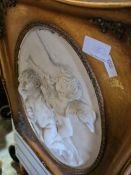 An art nouveau style plaque of two dancing ladies and one other resin plaque of cherubs