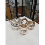 A very heavy silver tea service on a circular pedestal base, appearing of high quality. Comprising a