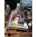 A box of various collectibles to include vintage tins, buttons, pens, etc