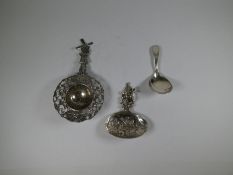 A Dutch silver tea strainer of very pretty, ornate design having articulated Windmill handle, pierce