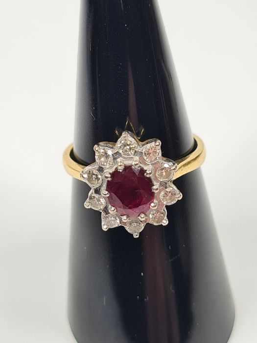 18ct yellow gold ruby and diamond cluster ring with central oval faceted ruby, approx 1 carat, surro - Image 4 of 4