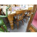 A modern pine oblong kitchen table with 6 chairs