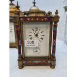 A French Brass carriage clock having enamelled decoration, four pillars, 17cm