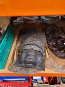 Five Nigerian carved wooden busts, similar wall masks and an Eastern sword
