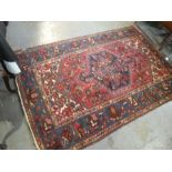 An old Iranian rug having central medallion, blue bordered