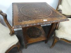 An early 20th Century, carved two tier table, probably 1920s, 61cm