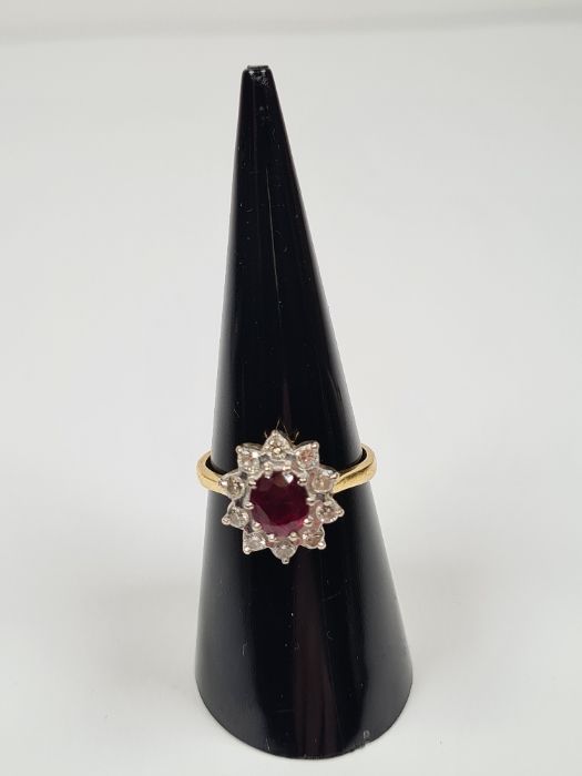 18ct yellow gold ruby and diamond cluster ring with central oval faceted ruby, approx 1 carat, surro - Image 3 of 4