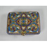 A 19th Century Russian silver gilt and cloisonne purse having polydrome arabesque body of high quali