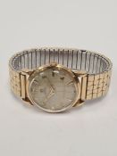 OMEGA, a gold plated Gents Omega Automatic wristwatch with a textured dial baton markers numbered 2,