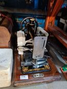 An antique sewing machine by Jones, converted to electric