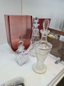 A 1930s decanter decorated female nudes by Ingrid Hoffman, a large Moses red glass vase and two Holm