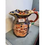 An antique 19th Century, Masonic jug with hydra handle, the body deep blue and decorated flowers and