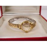 Vintage ladies gold plated Omega wristwatch with champagne dial, gold baton markers, winds and ticks