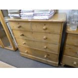 A Victorian stripped pine chest having 2 short and 3 long drawers