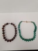 Heavy strand of large faceted Jade beads, together with a polished hardstone example