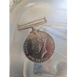 A World War II War Medal and French Medal inscribed VIMY April 9, 1917