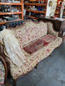 An old French carved Walnut settee having shaped back on cabriole legs