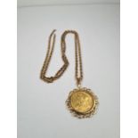 A 9ct yellow gold ropetwist design neckchain, 66cm long, marked 375, hung with a 9ct gold mounted 22