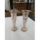 A pair of miniature Victorian silver vases having gadrooned feet and embossed floreated body. Hallma