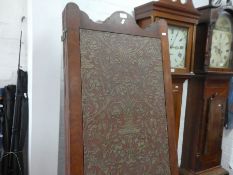 An early 20th Century, four fold draught screen with floral wallpaper panels