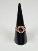 9ct yellow gold dress ring set large oval mixed cut amethyst, marked 375, London, maker FM, size O,