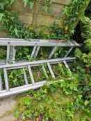 Two aluminium ladders, one being a step ladder