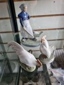 A pair of Royal Copenhagen chickens, a figure of boy with cow and one other of girl with duck
