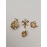 9ct oval locket with engraved plant decoration, 9ct heart charm, 9ct kettle charm, and 9ct sapphire
