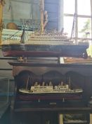 A reproduction model of a Titanic Life Boat and a quantity of other Titanic models and similar