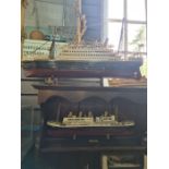 A reproduction model of a Titanic Life Boat and a quantity of other Titanic models and similar