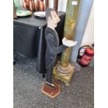 A rare 1920s-1930s Art Deco painted wood 'dumb waiter' stand in the form of a butler in a tailcoat,