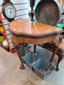 A reproduction burr walnut coffee table having pierced frieze and a similar demi lune card table
