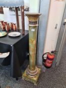 An unusual early 20th Century Egyptian revival glass and wood mounted column, the reverse painted gl