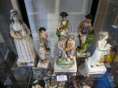 Seven antique Staffordshire figures of square bases