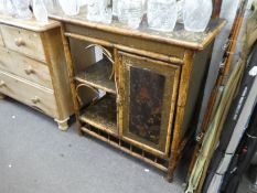 A Victorian bamboo sideboard having raised mirror back with one cupboard and open shelves