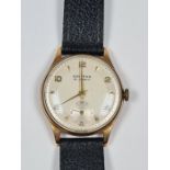 9ct yellow gold cased gents Griffon wristwatch with champagne dial, batons and numbers, subsidiary d