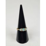 18ct gold and platinum dress ring, set with three oval opals, with blue hue, separated four small ro