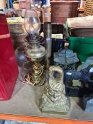 A selection of collectibles including door stops, oil lamps, barometers, etc