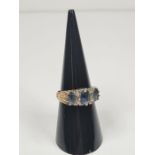 9ct gold dress ring set with 3 oval faceted pale blue sapphires, separated with diamond chips, marke