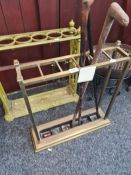 An early 20th Century brass stick stand having 6 divisions with 3 sticks