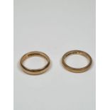 Two 9ct gold wedding bands of plain design, both marked 375, both size K, one with inscription "Luck