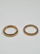 Two 9ct gold wedding bands of plain design, both marked 375, both size K, one with inscription "Luck